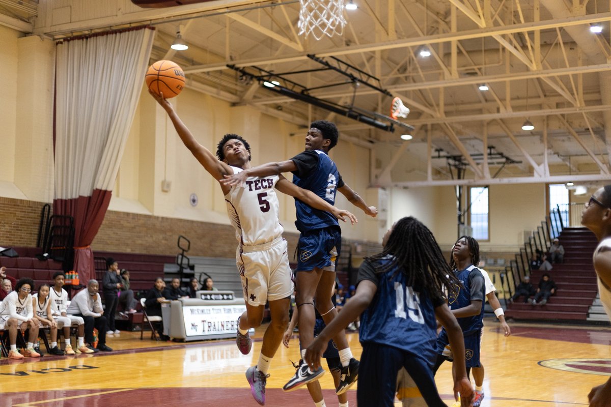 Basketball player going up for a layup
